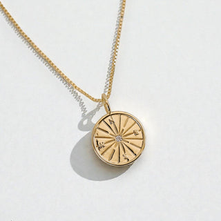 gold compass necklace